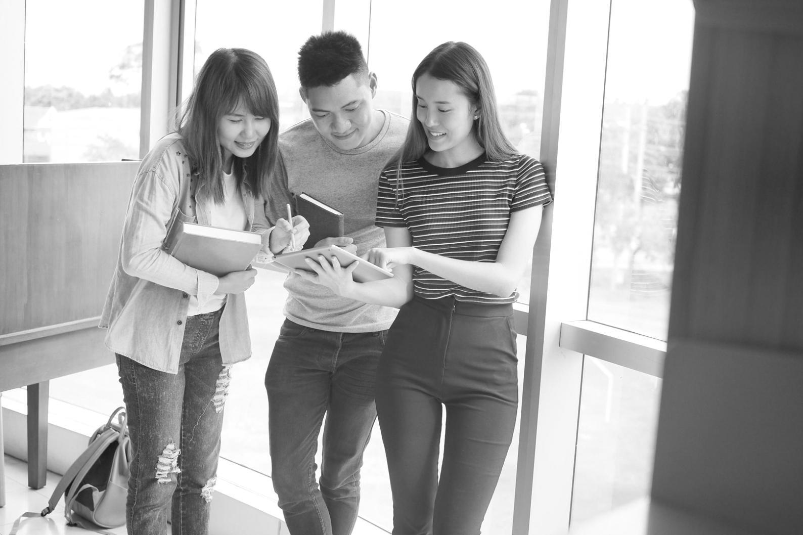 Students working on investment analysis case studies